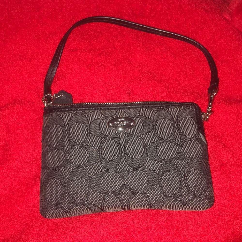 Coach wristlet black and dark grey, never used.